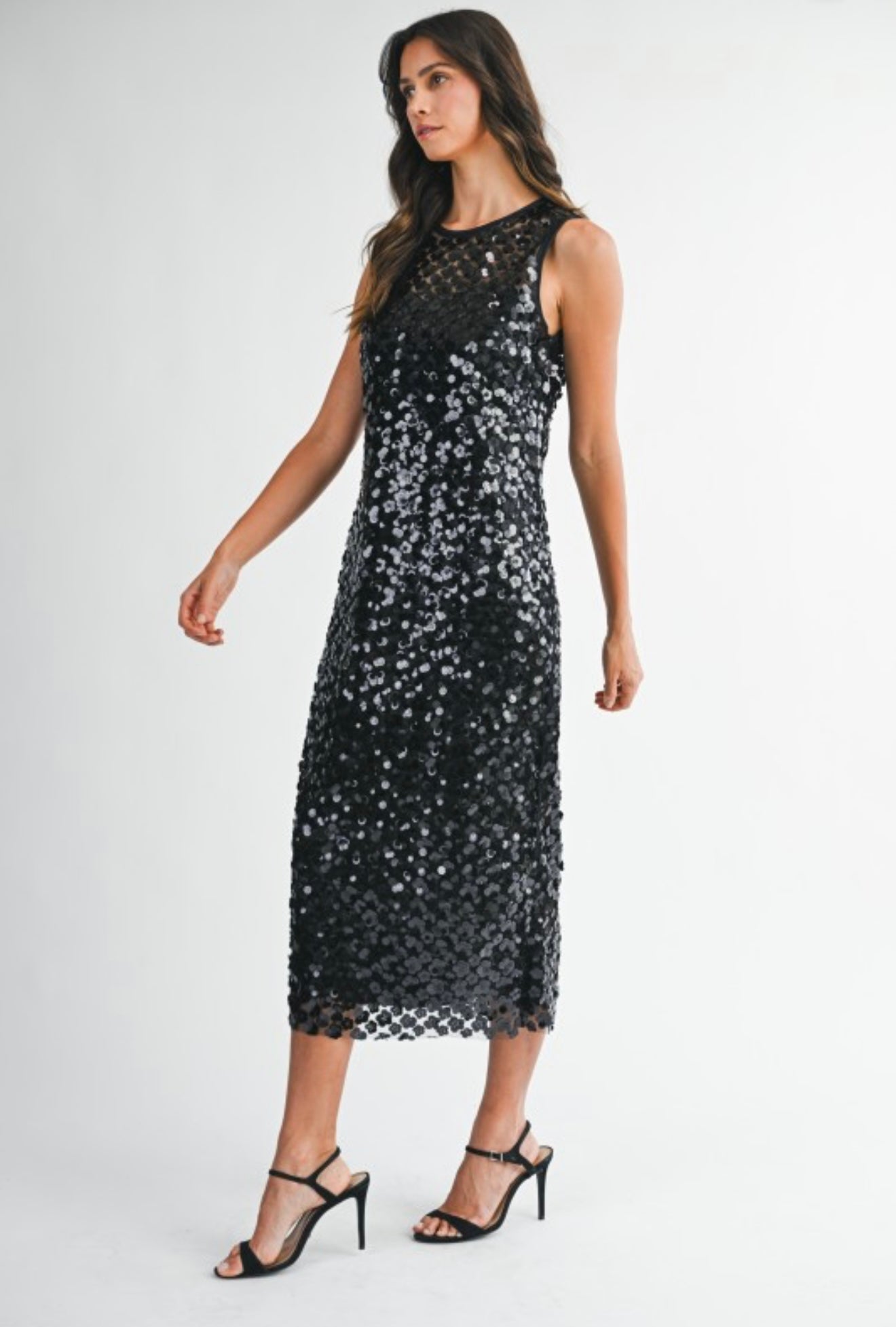 Elegant black sequin dress with sleeveless design, perfect for evening events or parties.